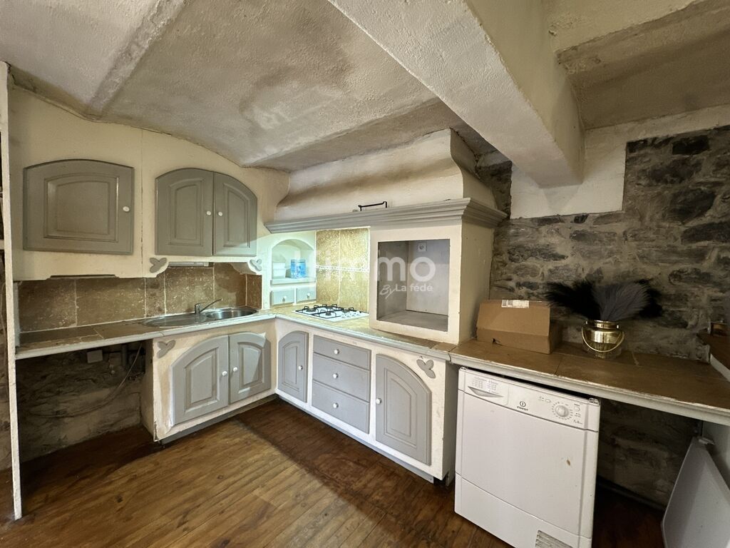 Photo 2 : Ensemble immobilier en pierre avec logements