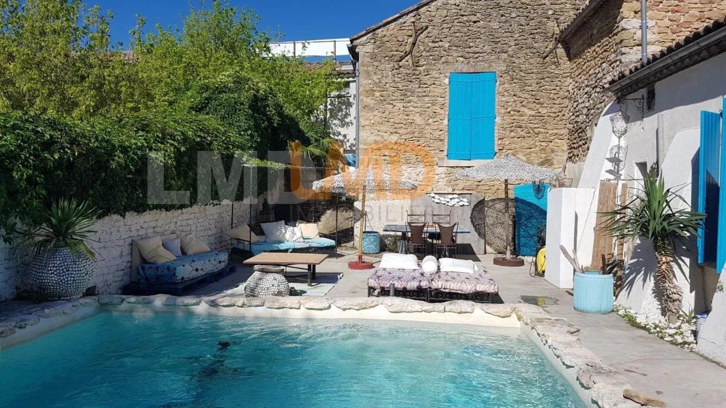 Photo 5 : maison en pierre de 140m2  .. piscine. garage