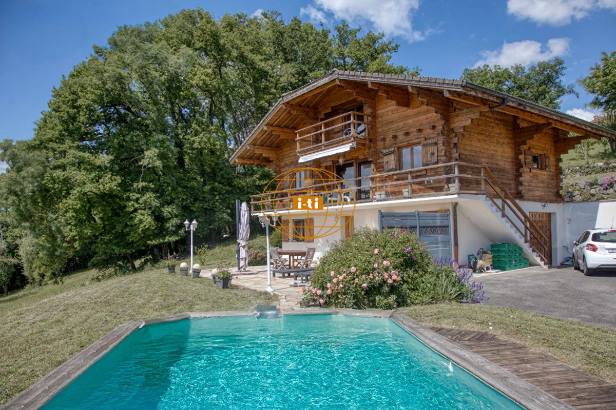 Photo 2 : ELEGANT CHALET MADRIER : 9 PIECES / 4 CHAMBRES 170 M² HABITABLES (273 M² AU SOL) - GRAND TERRAIN ARBORE : 4 180 M² AVEC PISCINE - CONTAMINE SUR ARVE (HAUTE SAVOIE)